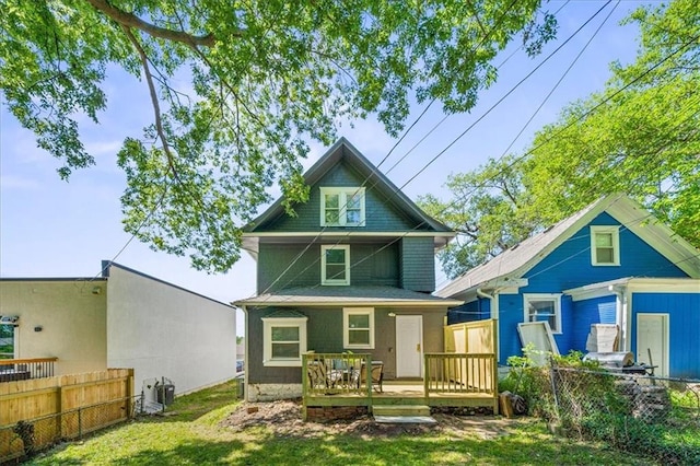 1316 E 42nd St, Kansas City, MO 64110 - rear view of property with a wooden deck