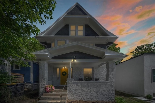 1316 E 42nd St, Kansas City, MO 64110 - view of front of property with covered porch and stone siding