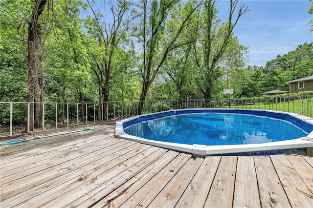 2311 Shawnee Dr, Kansas City, KS 66106 - view of swimming pool featuring a wooden deck and view of scattered trees