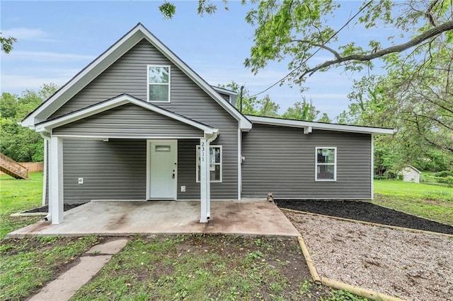 2311 Shawnee Dr, Kansas City, KS 66106 - view of front facade featuring a patio area and a front lawn