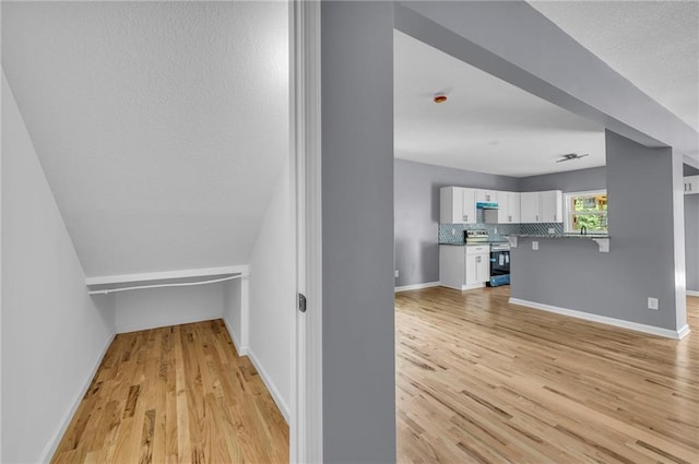 2311 Shawnee Dr, Kansas City, KS 66106 - corridor with light wood-style flooring and baseboards