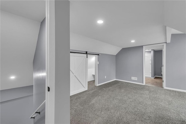 2311 Shawnee Dr, Kansas City, KS 66106 - bonus room featuring a barn door, carpet, baseboards, recessed lighting, and vaulted ceiling