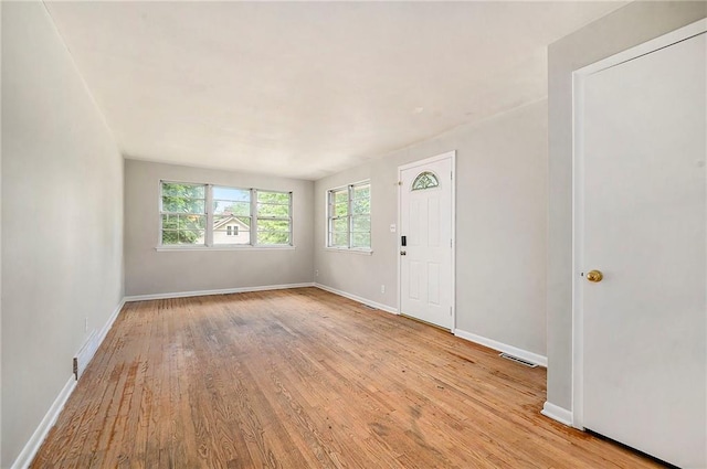 501 Maple Ave, Smithville, MO 64089 - foyer with light wood finished floors and baseboards