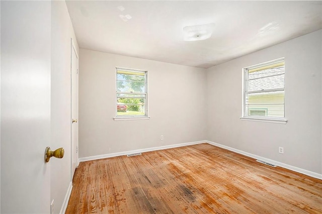 501 Maple Ave, Smithville, MO 64089 - unfurnished room with baseboards and light wood-style flooring