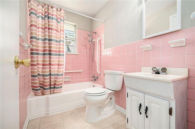 501 Maple Ave, Smithville, MO 64089 - bathroom with shower / bath combo with shower curtain, vanity, toilet, and tile walls