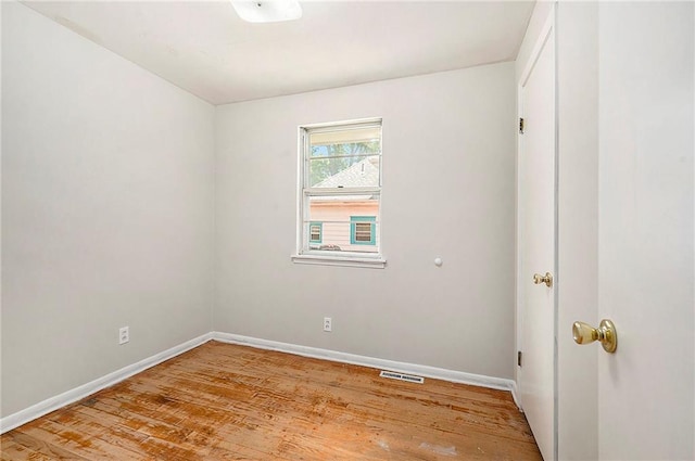501 Maple Ave, Smithville, MO 64089 - unfurnished room with light wood finished floors and baseboards