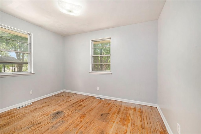 501 Maple Ave, Smithville, MO 64089 - spare room with light wood-style flooring and baseboards