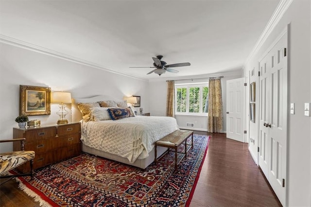 2210 W 69th Ter, Mission Hills, KS 66208 - bedroom featuring ornamental molding, dark wood-type flooring, baseboards, and ceiling fan