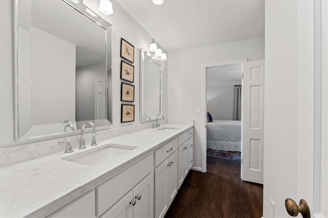2210 W 69th Ter, Mission Hills, KS 66208 - ensuite bathroom with double vanity and wood finished floors