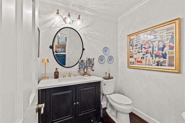 2210 W 69th Ter, Mission Hills, KS 66208 - bathroom featuring toilet, vanity, crown molding, wood finished floors, and baseboards