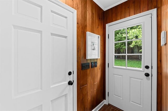 2210 W 69th Ter, Mission Hills, KS 66208 - doorway to outside with brick patterned flooring, wooden walls, and crown molding