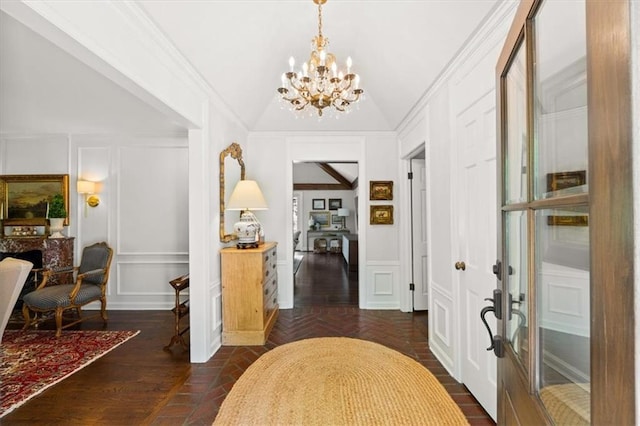 2210 W 69th Ter, Mission Hills, KS 66208 - foyer with a decorative wall, a chandelier, and vaulted ceiling