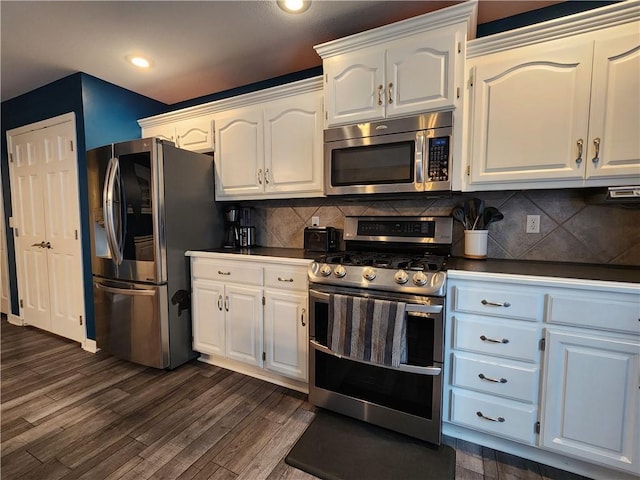 9001 NE 109th Ter, Kansas City, MO 64157 - kitchen featuring appliances with stainless steel finishes, dark wood-style floors, white cabinets, decorative backsplash, and recessed lighting