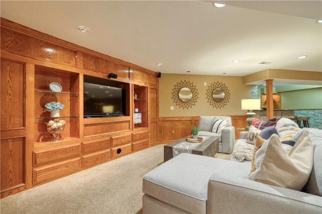 13011 Long St, Overland Park, KS 66213 - living room with carpet floors, a wainscoted wall, ornate columns, built in shelves, and recessed lighting