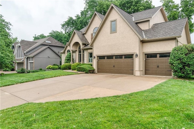 13011 Long St, Overland Park, KS 66213 - view of front of home with a front lawn, stucco siding, concrete driveway, a shingled roof, and a garage