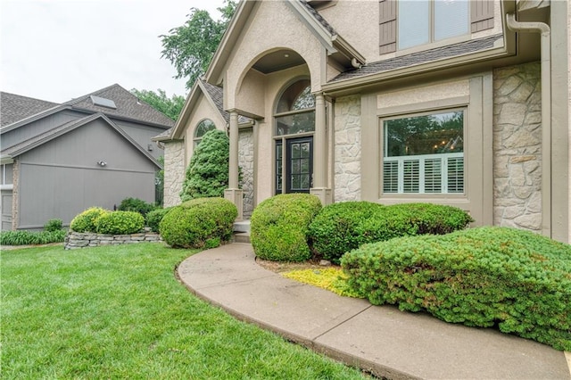 13011 Long St, Overland Park, KS 66213 - doorway to property with stone siding and a lawn