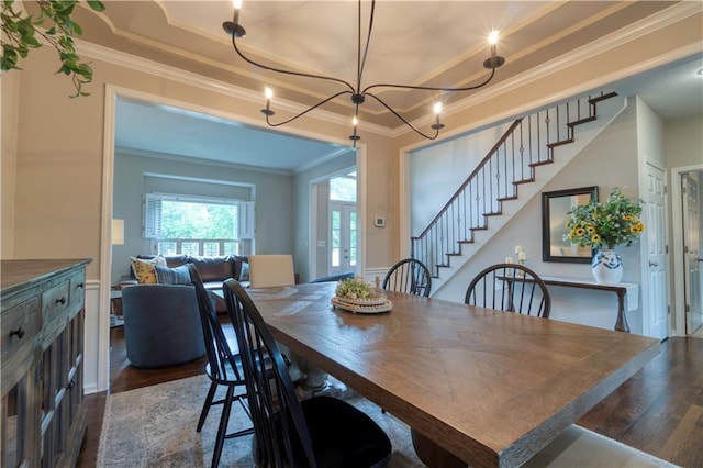 13011 Long St, Overland Park, KS 66213 - dining room with dark wood-type flooring, a raised ceiling, ornamental molding, stairway, and a chandelier