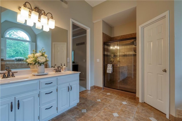 13011 Long St, Overland Park, KS 66213 - full bathroom with double vanity, a stall shower, tile patterned flooring, and baseboards