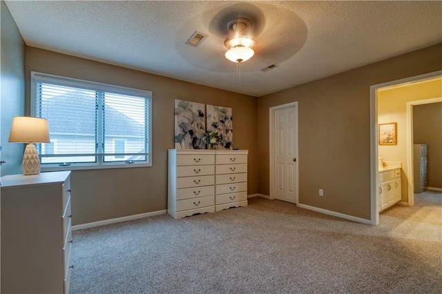 13011 Long St, Overland Park, KS 66213 - bedroom with light colored carpet, a textured ceiling, baseboards, and a ceiling fan