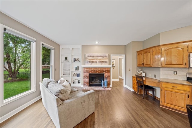 14450 W 146th Ter, Olathe, KS 66062 - living room with healthy amount of natural light, wood finished floors, baseboards, and recessed lighting