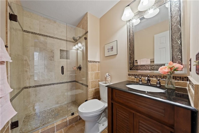 14450 W 146th Ter, Olathe, KS 66062 - bathroom featuring toilet, vanity, a stall shower, and backsplash