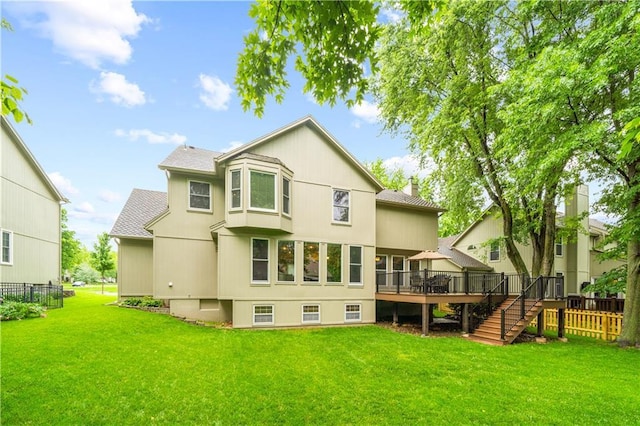 14450 W 146th Ter, Olathe, KS 66062 - rear view of property featuring a wooden deck, stairway, roof with shingles, and a chimney