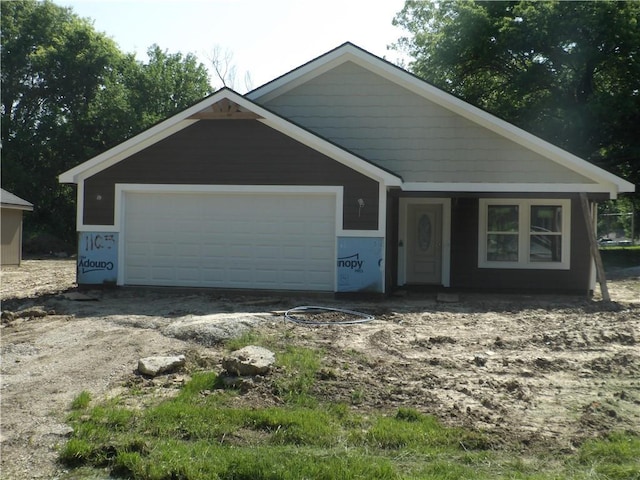 1105 S Olive St, Holden, MO 64061 - view of front of home featuring an attached garage