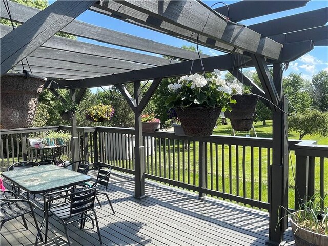 1211 N 6th St, Hiawatha, KS 66434 - wooden deck with a pergola and a lawn