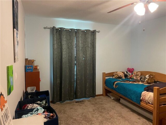 1211 N 6th St, Hiawatha, KS 66434 - carpeted bedroom with a ceiling fan