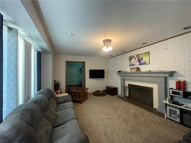 1211 N 6th St, Hiawatha, KS 66434 - carpeted living area with a fireplace