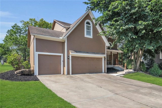 12726 S Rene St, Olathe, KS 66062 - traditional home featuring concrete driveway, a front yard, roof with shingles, and a garage