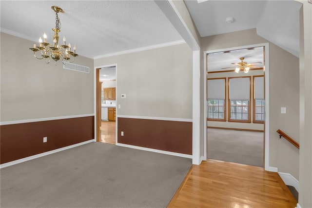 12726 S Rene St, Olathe, KS 66062 - unfurnished room featuring a chandelier, a ceiling fan, wood finished floors, baseboards, and ornamental molding