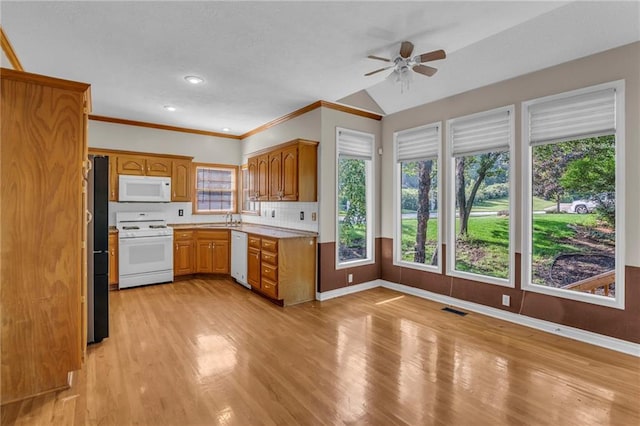 12726 S Rene St, Olathe, KS 66062 - kitchen featuring white appliances, a sink, a ceiling fan, light wood-type flooring, and baseboards
