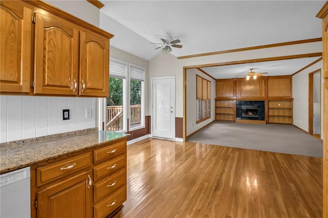 12726 S Rene St, Olathe, KS 66062 - kitchen featuring ceiling fan, brown cabinets, decorative backsplash, white dishwasher, and open floor plan