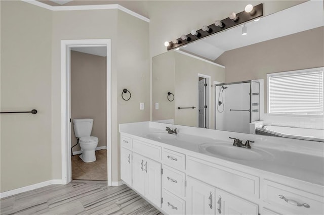 12726 S Rene St, Olathe, KS 66062 - full bathroom featuring a stall shower, toilet, a garden tub, double vanity, and baseboards