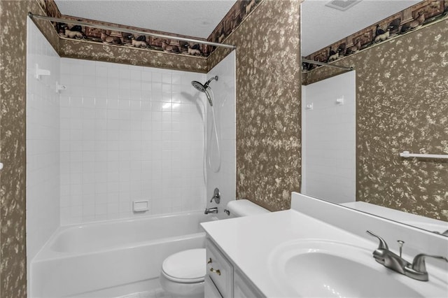 12726 S Rene St, Olathe, KS 66062 - bathroom featuring wallpapered walls, toilet, a textured ceiling, vanity, and shower / tub combination