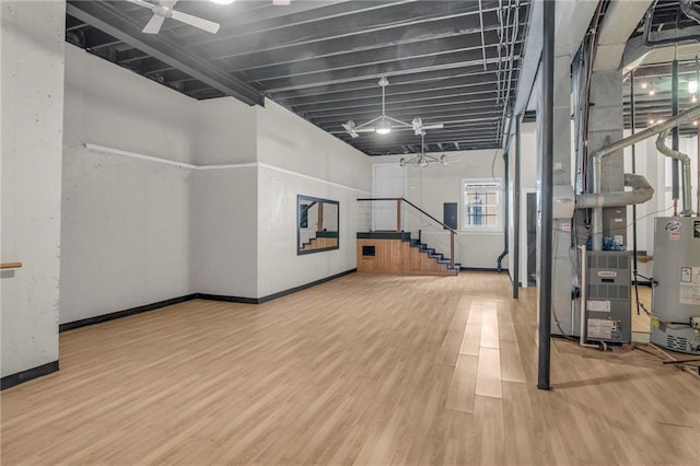 12726 S Rene St, Olathe, KS 66062 - workout area featuring gas water heater, wood finished floors, ceiling fan, and baseboards