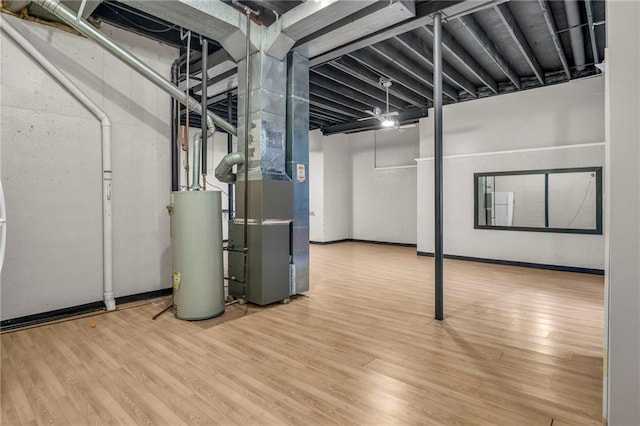 12726 S Rene St, Olathe, KS 66062 - below grade area with gas water heater and wood finished floors
