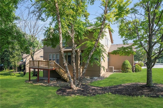 12726 S Rene St, Olathe, KS 66062 - back of house featuring stairway, a lawn, a wooden deck, stucco siding, and cooling unit