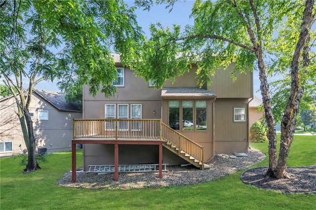 12726 S Rene St, Olathe, KS 66062 - rear view of house featuring stairs, a deck, and a lawn