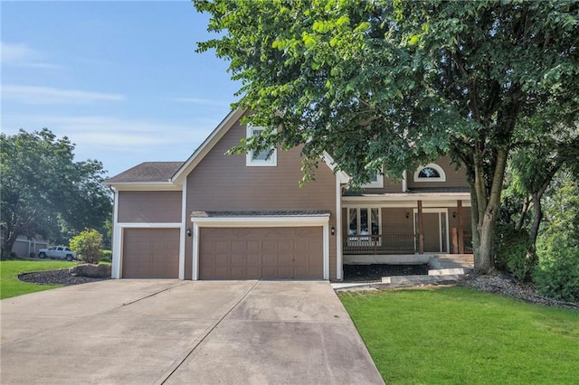 12726 S Rene St, Olathe, KS 66062 - view of front of property featuring a front lawn, a porch, and concrete driveway