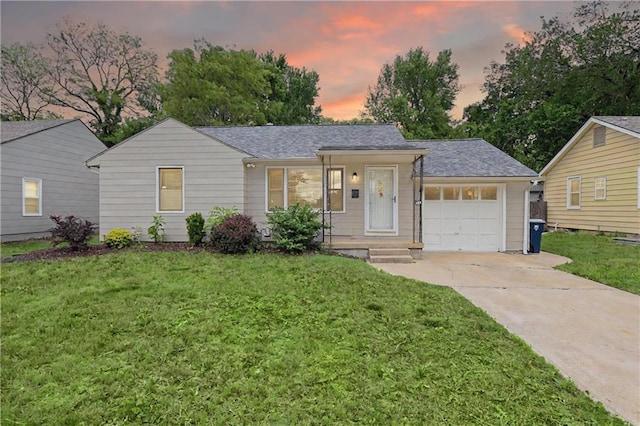 8604 E 79th St, Kansas City, MO 64138 - ranch-style house with driveway, a front yard, a garage, and a shingled roof