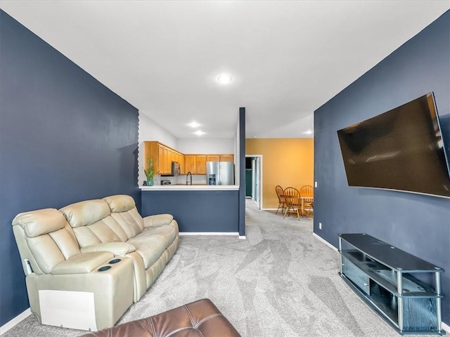 1151 N Mart-Way Dr Unit 103, Olathe, KS 66061 - living area featuring light colored carpet, baseboards, and recessed lighting