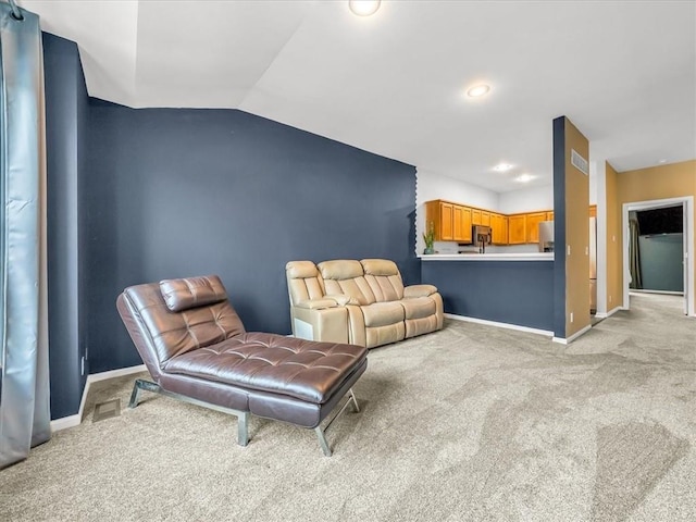 1151 N Mart-Way Dr Unit 103, Olathe, KS 66061 - living area featuring light carpet, baseboards, vaulted ceiling, and recessed lighting