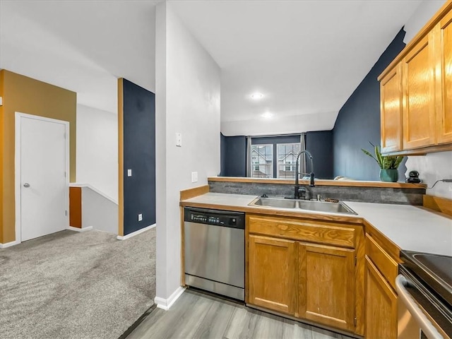 1151 N Mart-Way Dr Unit 103, Olathe, KS 66061 - kitchen featuring stainless steel appliances, a sink, light countertops, and brown cabinets