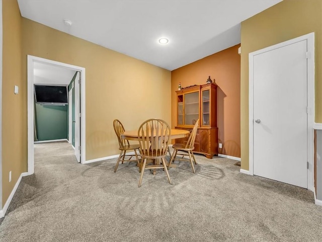 1151 N Mart-Way Dr Unit 103, Olathe, KS 66061 - carpeted dining space featuring baseboards