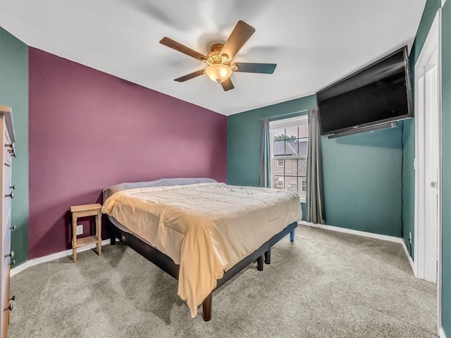 1151 N Mart-Way Dr Unit 103, Olathe, KS 66061 - bedroom with carpet flooring, baseboards, and a ceiling fan