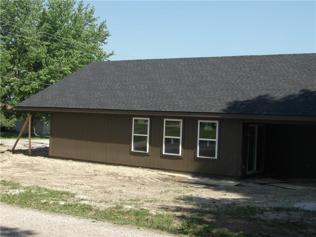 303 S Lexington St, Holden, MO 64061 - view of home's exterior with a shingled roof