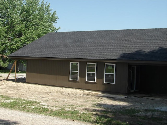 303 S Lexington St, Holden, MO 64061 - view of home's exterior with a shingled roof