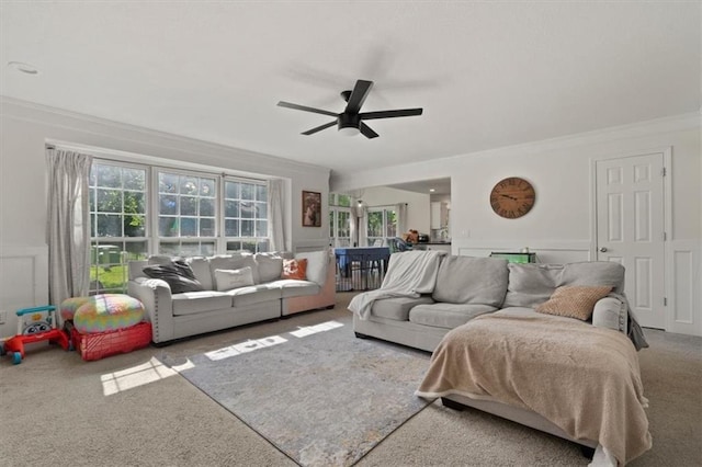 8443 Mettee St, Lenexa, KS 66219 - carpeted living area with a decorative wall, a ceiling fan, ornamental molding, and wainscoting